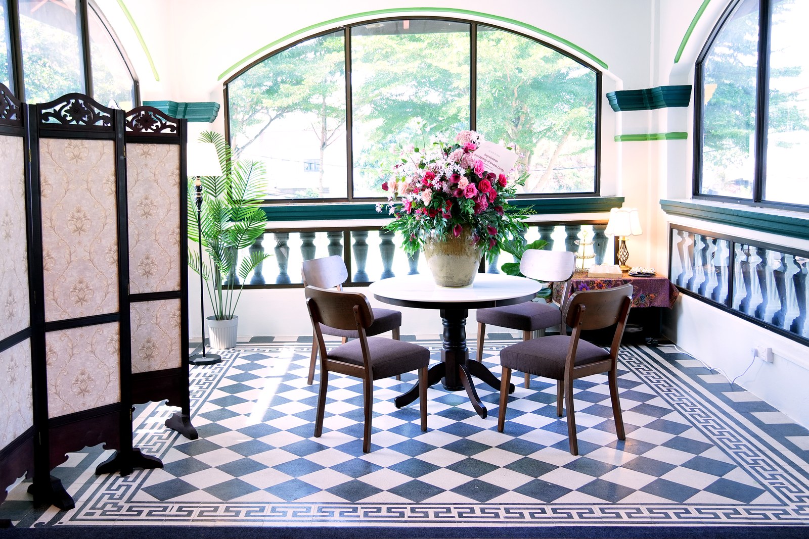 A round table by a bay window, suited to working or a shared meal